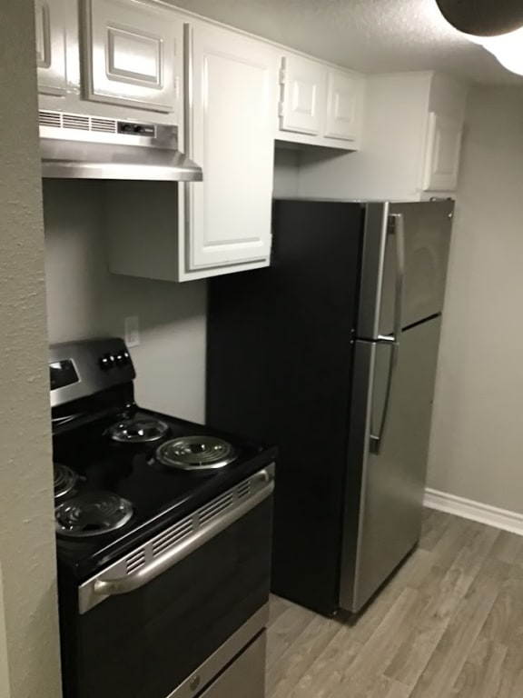 a kitchen with a stove and a refrigerator &#xA0;at 2151 Kirkwood, Houston, TX, 77077