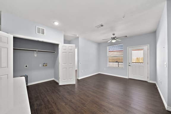 Empty bedroom with hardwood floors and builtin closet at The Aurea Apartments, Houston