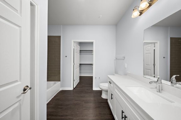 a bathroom with a sink and a toilet and a shower
