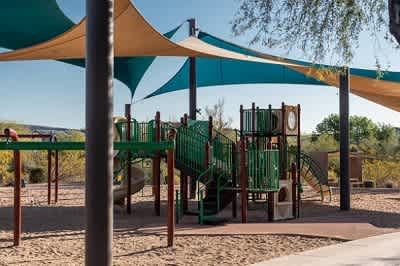 a playground with a slide and climbing equipment