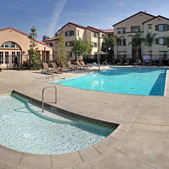 A swimming pool with a ladder in the middle of it.