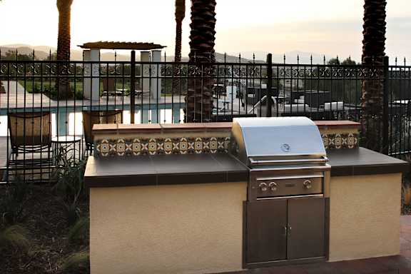 A barbecue grill is on a table outside.