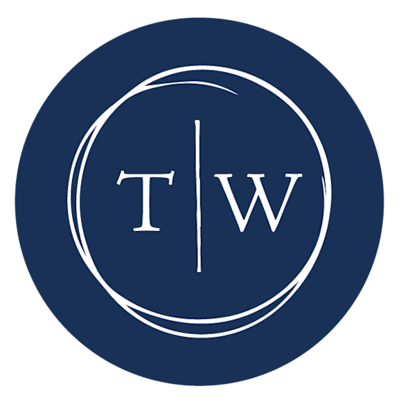 A blue circle with the letters T and W separated by a vertical line at Town Walk at Hamden Hills, Connecticut, 06518