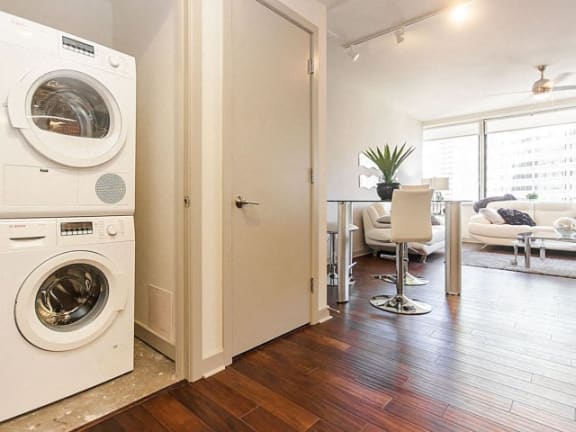 a living room with a washing machine and a dryer