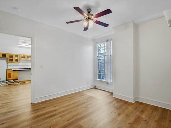 Unfurnished room with wooden floor at The Langham Apartments, Los Angeles, 90005