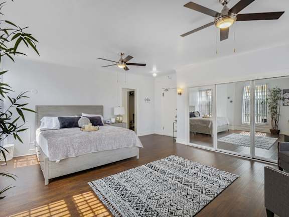Bedroom with comfortable bed at The Langham Apartments, Los Angeles, CA, 90005