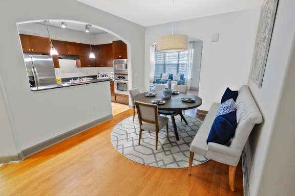 A modern kitchen with a dining table and chairs. at The Estates at Ballantyne, Charlotte, 28277