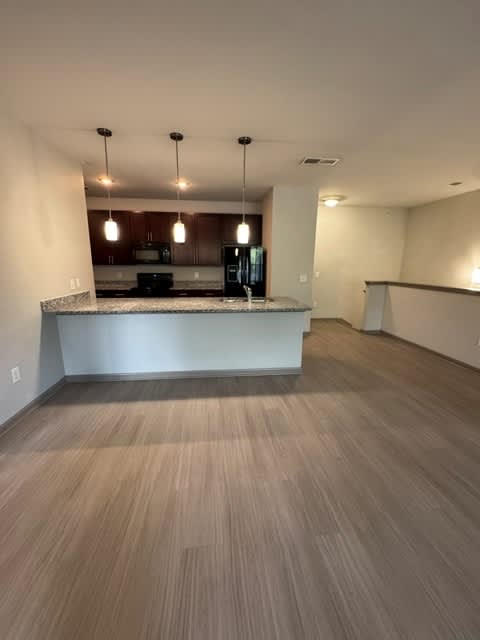 A kitchen with a counter and cabinets is shown.