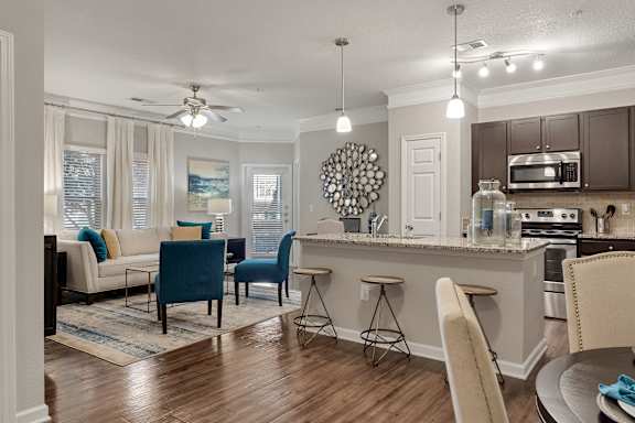 A kitchen with a dining table and chairs. at Echo at Lake Norman, Mooresville, NC