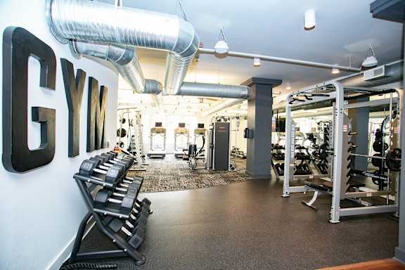 Gym with weights at Mariposa Lofts, Atlanta, Georgia