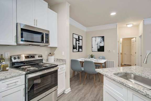 A kitchen with a black and white color scheme.
