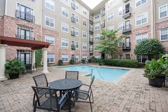 pool with patio table at The Orleans of Decatur, Decatur, Georgia