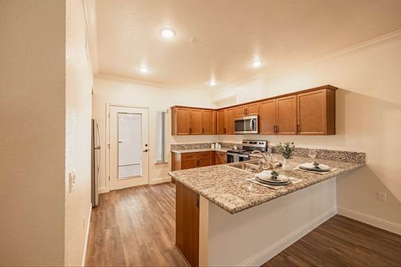 A Kitchen with Microwave at The Villas at Ellis Manor, Fresno, CA
