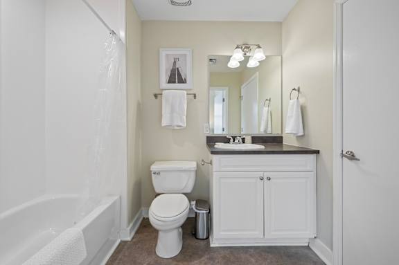 A white toilet sits in a bathroom next to a white bathtub.