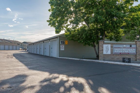 an empty parking lot next to a row of garages at Shiloh Glen, Billings, 59102