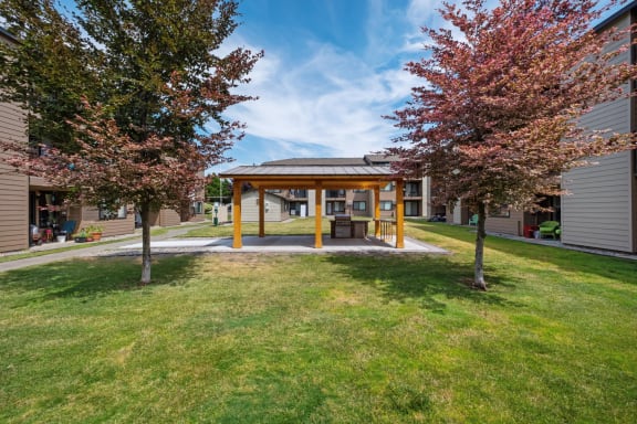 a pavilion with trees on the grass in front of a building at Brix, Washington