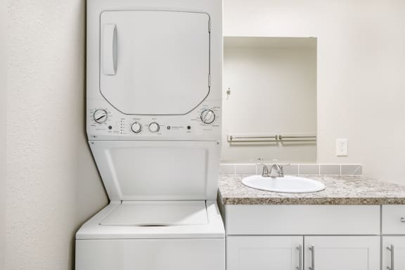 a washer and dryer in a bathroom  at Wildflower, Washington