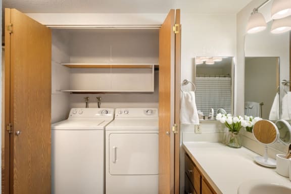 Full size washer and dryer inside a closet at Cedarwood Apartments.