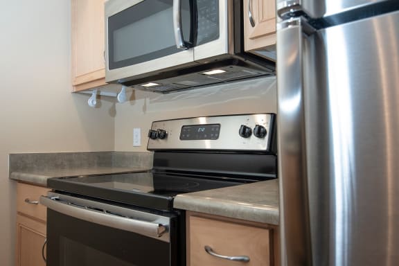 a kitchen with stainless steel appliances and a microwave  at 6 Wood Flats, Lacey