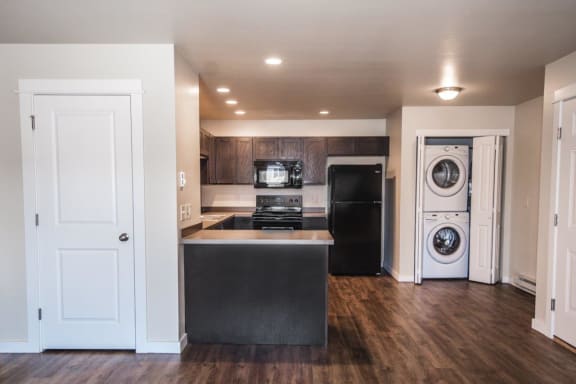 a renovated kitchen with a washer and dryer in it at Madison Park, Bozeman, MT