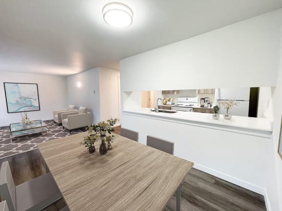 a living room and dining room with a table and a kitchen  at The Trail, Snohomish
