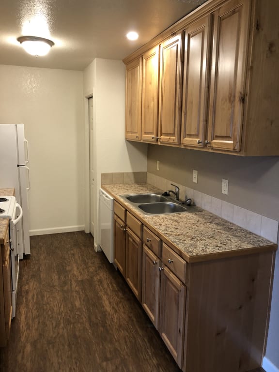 an apartment kitchen at kirkwood meadows with top and bottom cabinets.at Kirkwood Meadows, Pocatello, ID