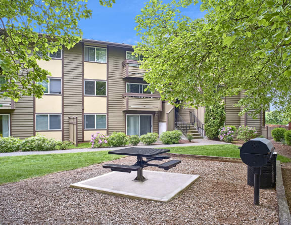 our apartments have a picnic area with a table and a grill