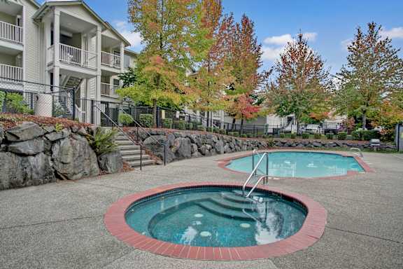 A small pool with a red border and a ladder in the middle.