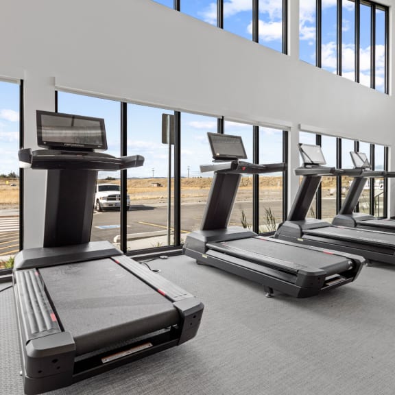 three treadmills in front of windows in a gym at Yellowstone Landing, Belgrade, MT, 59714
