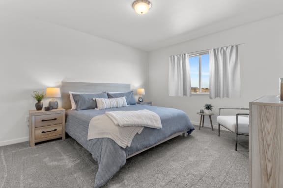 a bedroom with a bed and a desk and a window at Yellowstone Landing, Belgrade, MT, 59714