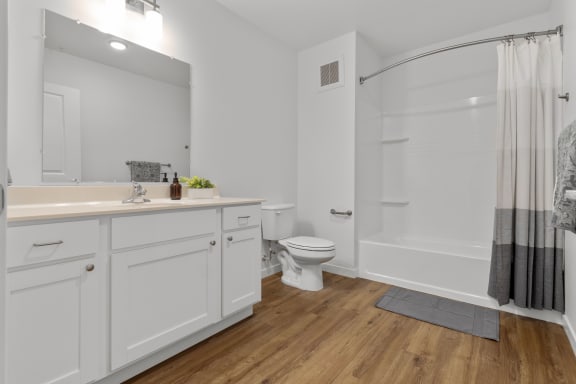 a white bathroom with a shower and a sink and a toilet at Yellowstone Landing, Belgrade, MT, 59714