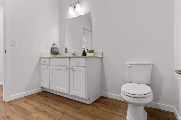 an empty bathroom with a toilet and a sink  at Yellowstone Landing, Belgrade, 59714