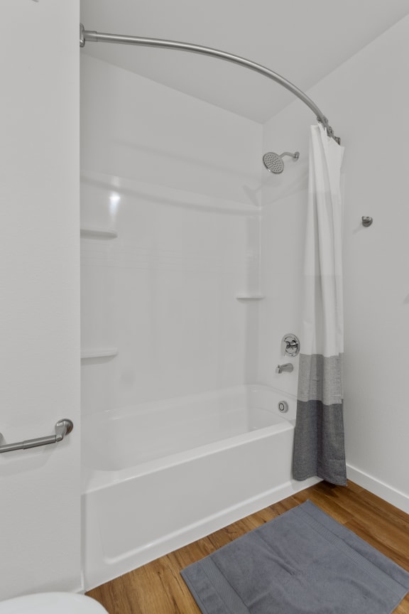 a bathroom with a shower and a rug in it at Yellowstone Landing, Belgrade, Montana