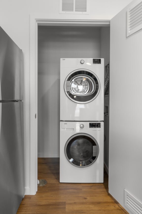 a white washer and dryer in a small laundry room at Yellowstone Landing, Montana, 59714