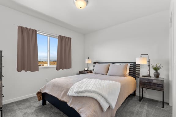 a bedroom with a bed and a window at Yellowstone Landing, Montana, 59714
