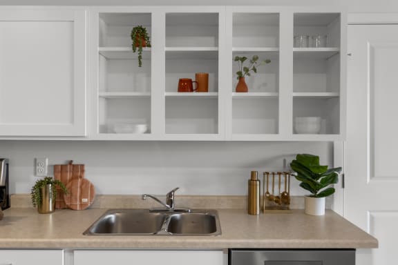 a kitchen with white cabinets and a sink at Yellowstone Landing, Montana, 59714