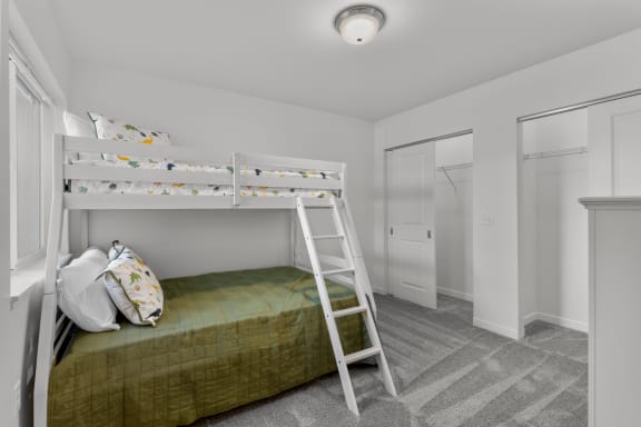 a bedroom with a bunk bed and a ladder in it at Yellowstone Landing, Belgrade