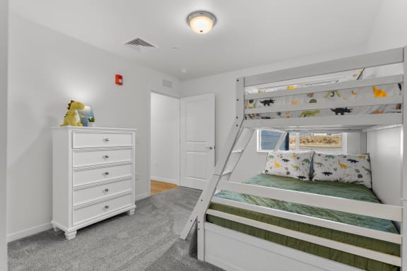 a bedroom with a bunk bed and a dresser at Yellowstone Landing, Belgrade