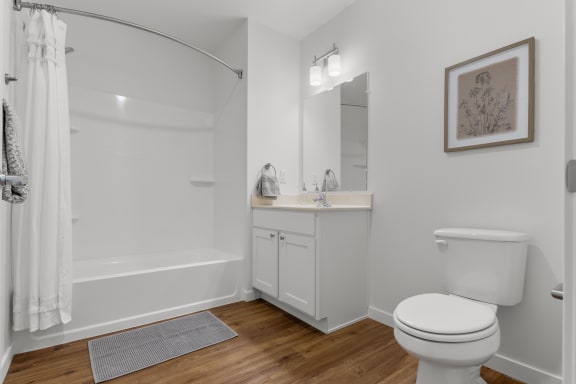 a bathroom with a toilet and a tub and a sink at Yellowstone Landing, Belgrade, MT, 59714