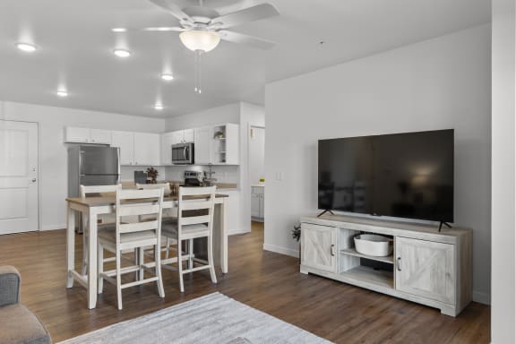 a living room with a dining room and a kitchen with a table and chairs at Yellowstone Landing, Belgrade, MT, 59714
