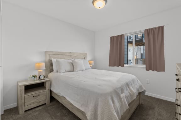 a bedroom with a bed and a window at Yellowstone Landing, Belgrade, MT, 59714