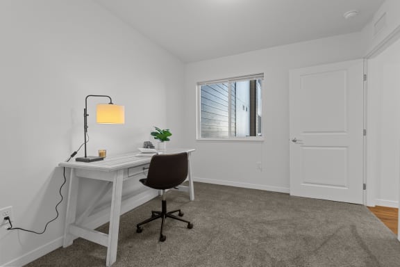 a home office with a white desk and chair and a window at Yellowstone Landing, Montana, 59714