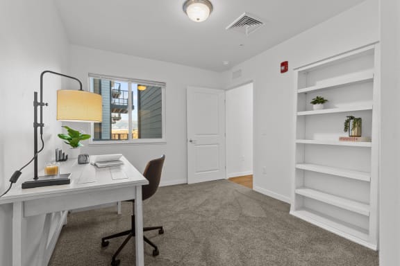 a home office with a white desk and white shelves  at Yellowstone Landing, Montana