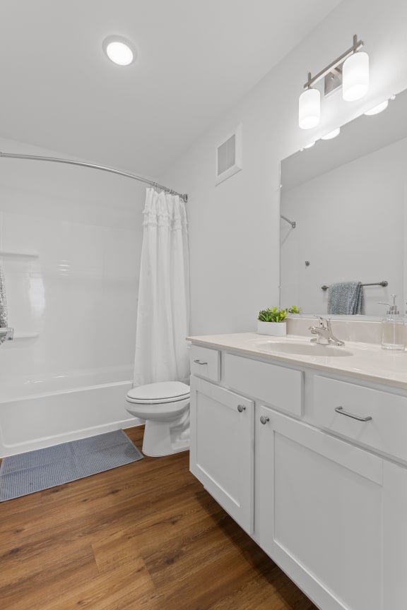 a bathroom with a large mirror and a toilet and a sink at Yellowstone Landing, Montana