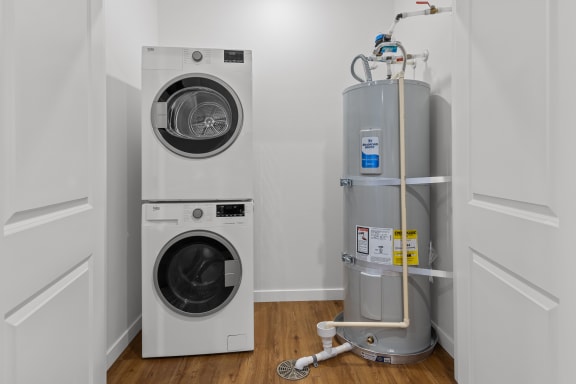 a laundry room with a washing machine and a water tank at Yellowstone Landing, Belgrade, MT