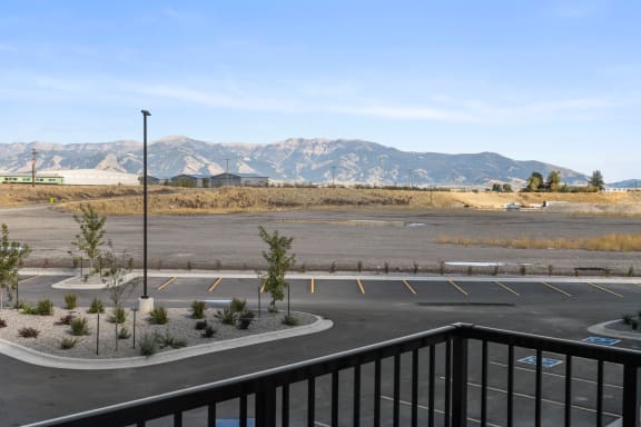 the view of the parking lot and mountains from the balcony  at Yellowstone Landing, Belgrade, MT, 59714