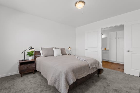 a bedroom with a large bed and white walls at Yellowstone Landing, Belgrade, MT, 59714