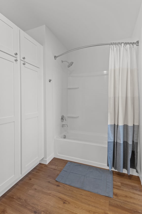 a white bathroom with a shower and a shower curtain at Yellowstone Landing, Belgrade, MT, 59714