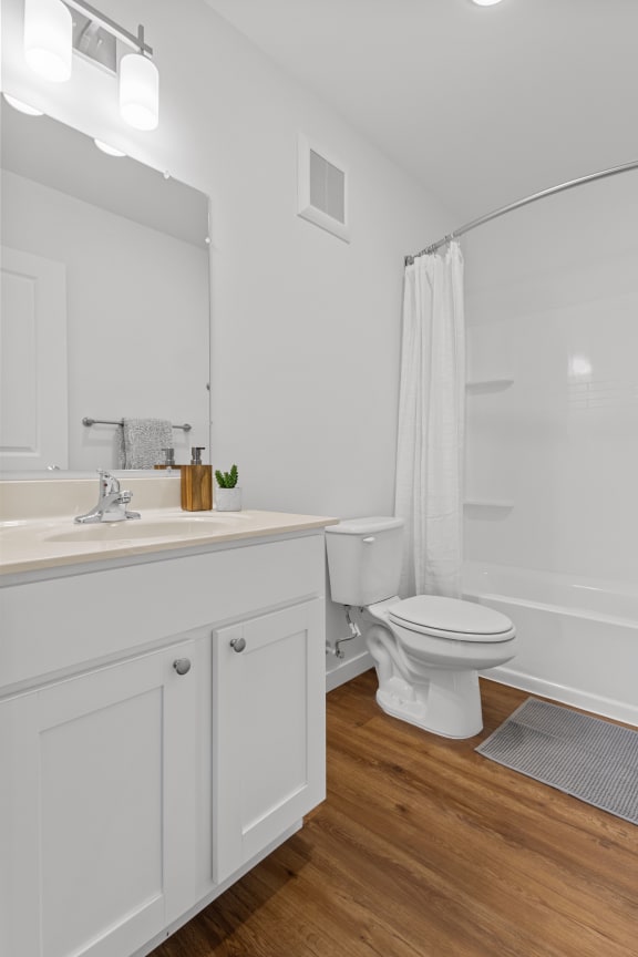 a bathroom with a toilet and a sink and a mirror at Yellowstone Landing, Montana