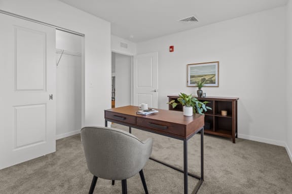 an office with a desk and a chair in a living room at Yellowstone Landing, Montana